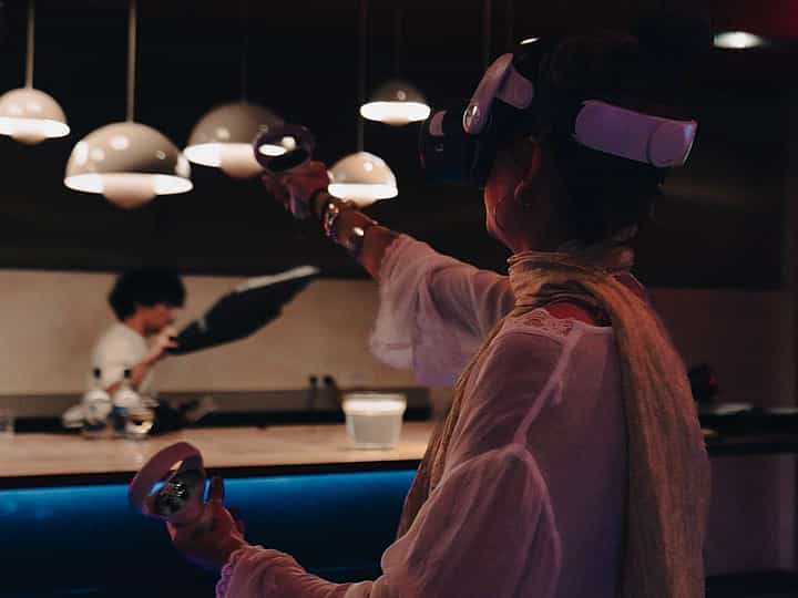 People trying VR headsets at an educational event