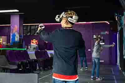 Children experiencing virtual reality with VR headsets