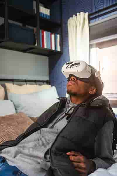 A person using a rented VR headset at home