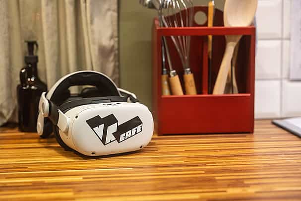 Meta quest 2 headset rent from VRcafe Haarlem VR@HOME service laying on a wooden kitchen top